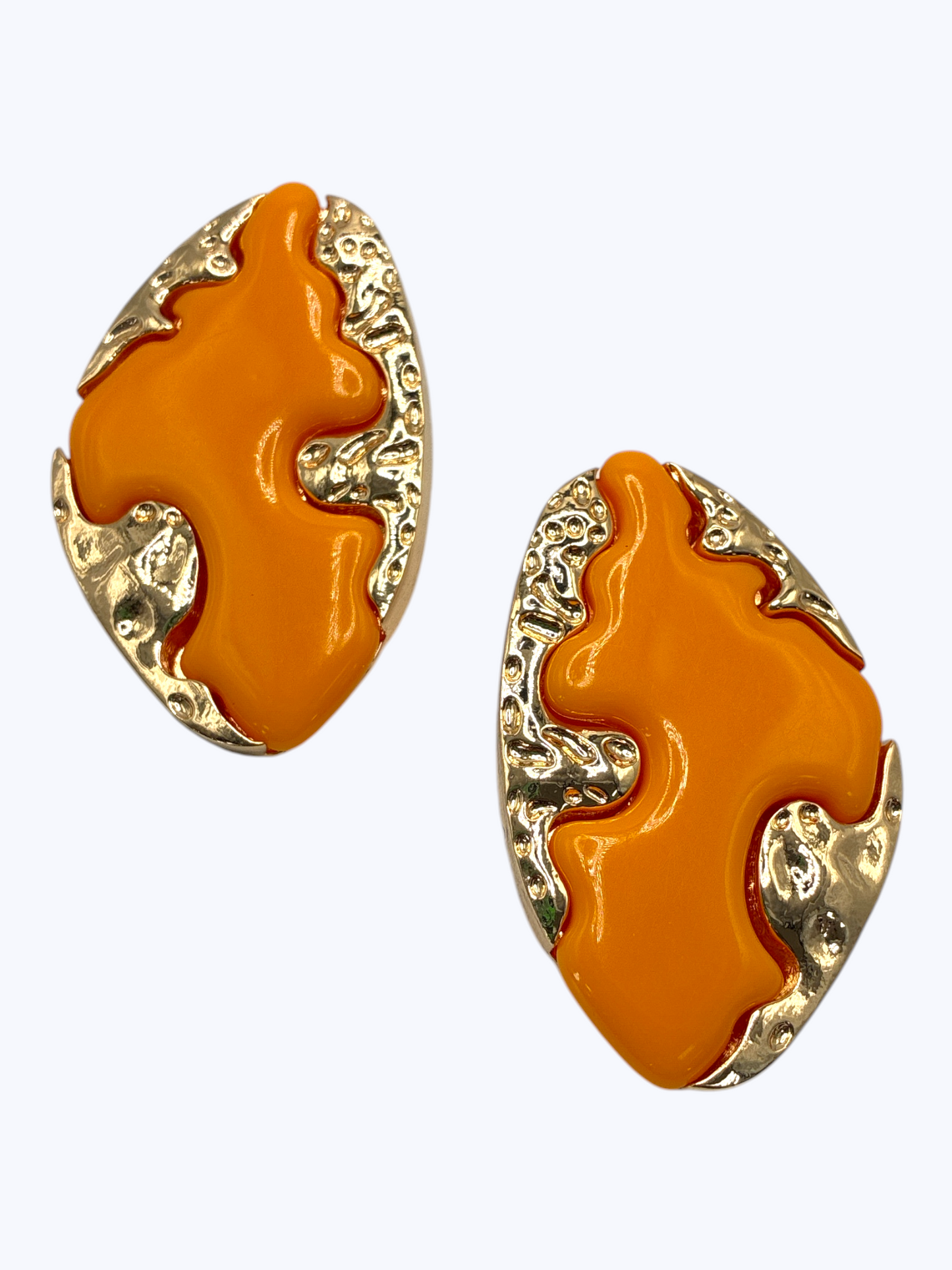 Modern abstract drop earrings featuring sculptural metallic base with bold organic enamel overlay design.