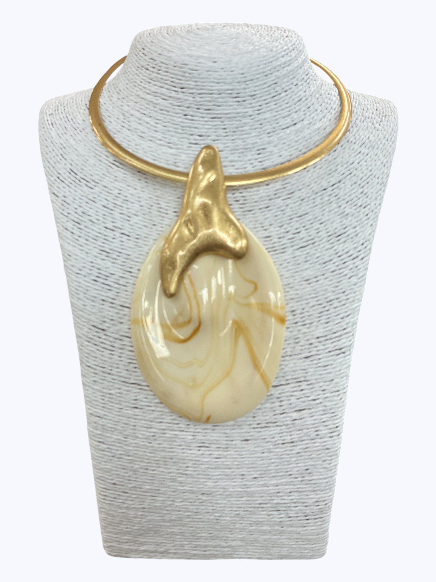 Modern sculptural collar necklace with oversized marbled resin teardrop pendant and metallic abstract accent displayed on mannequin bust.