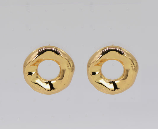 Pair of gold hoop earrings on a light gray background