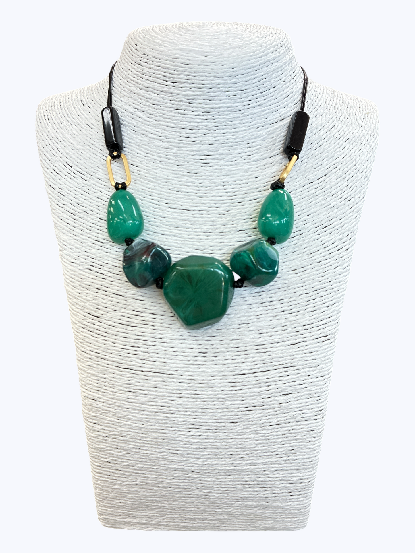 Green statement bead necklace with glossy marbled resin stones, black cord, and gold-tone accents for a bold contemporary boutique look.