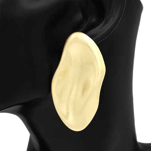 Gold oval earring on a black mannequin ear