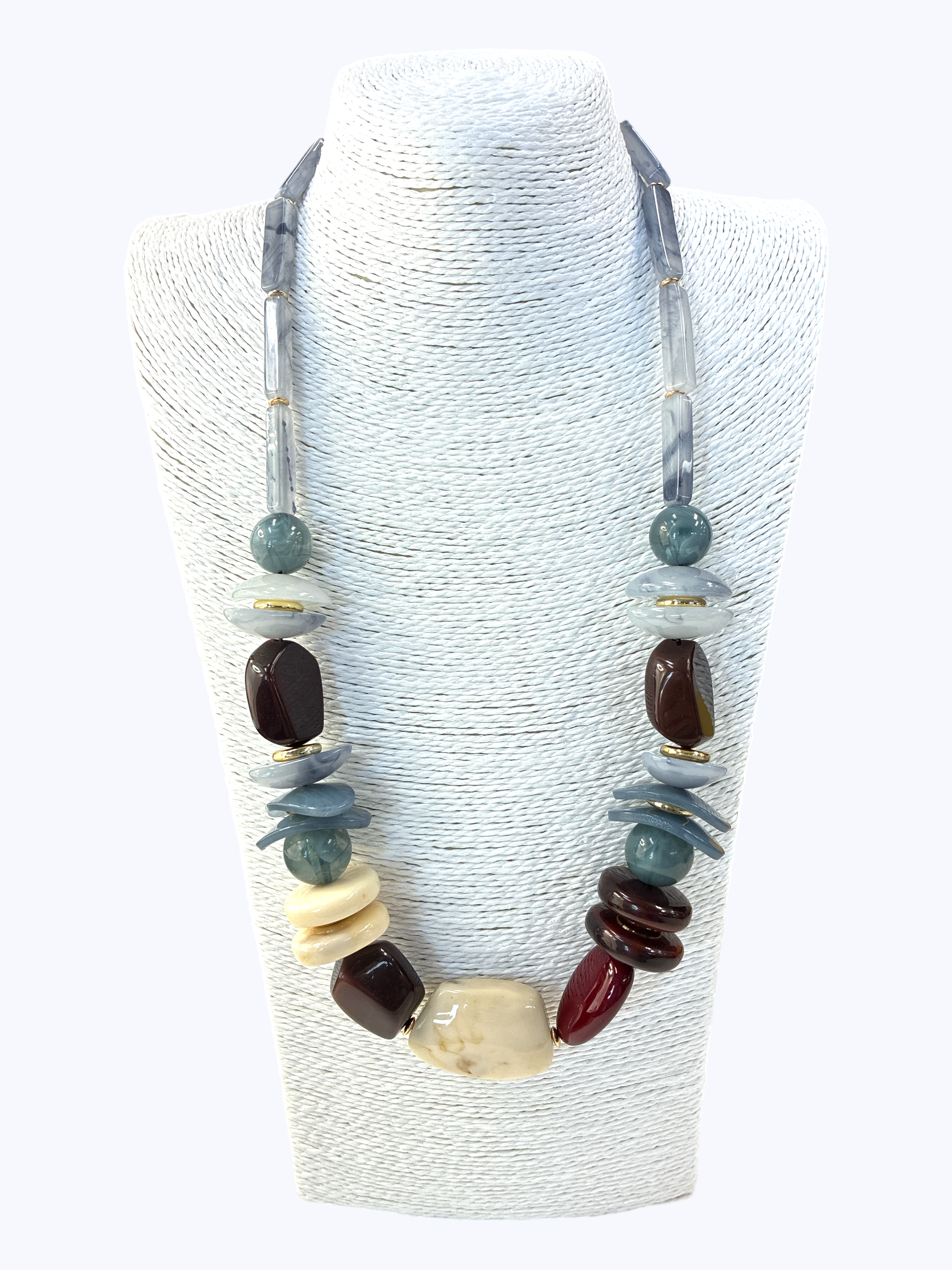 Necklace with multicolored beads on a white stand