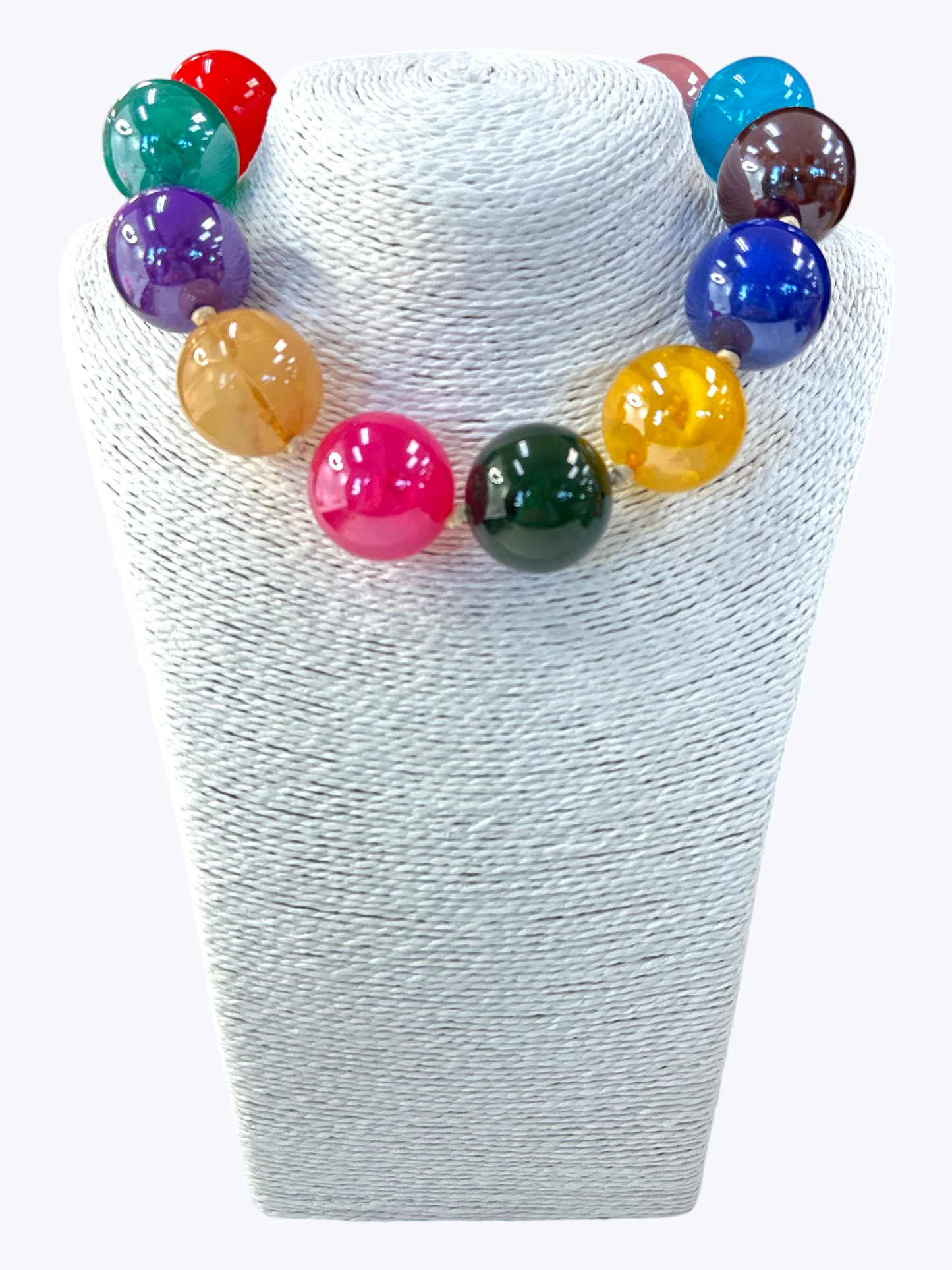 Colorful beaded necklace on a white mannequin bust