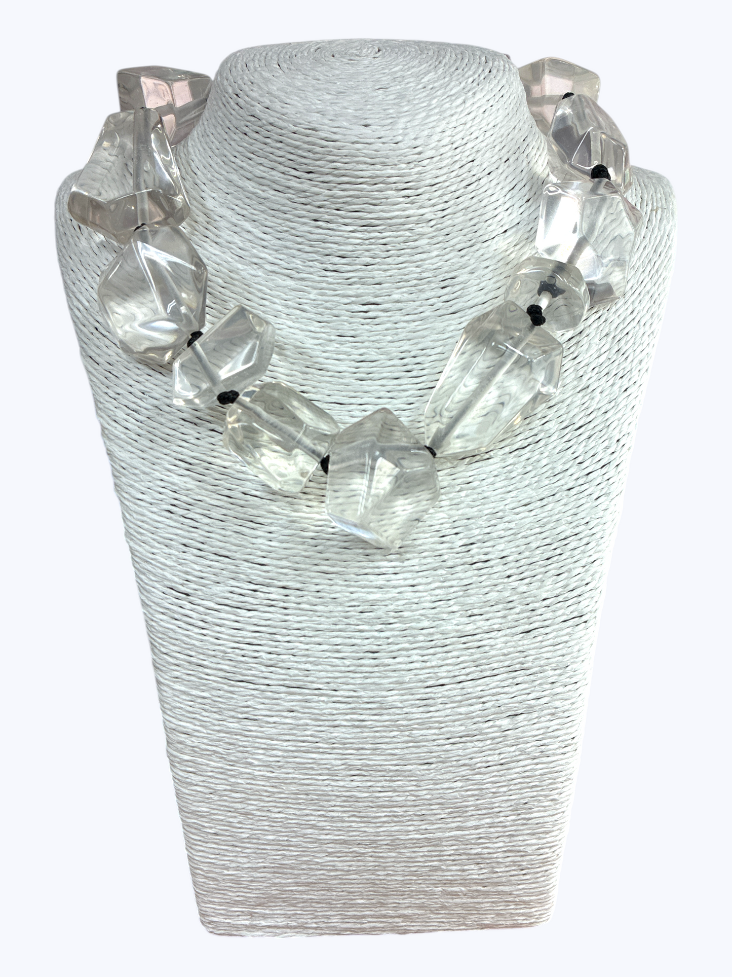 Chunky geometric acrylic necklace featuring oversized translucent faceted beads in a bold modern statement design.