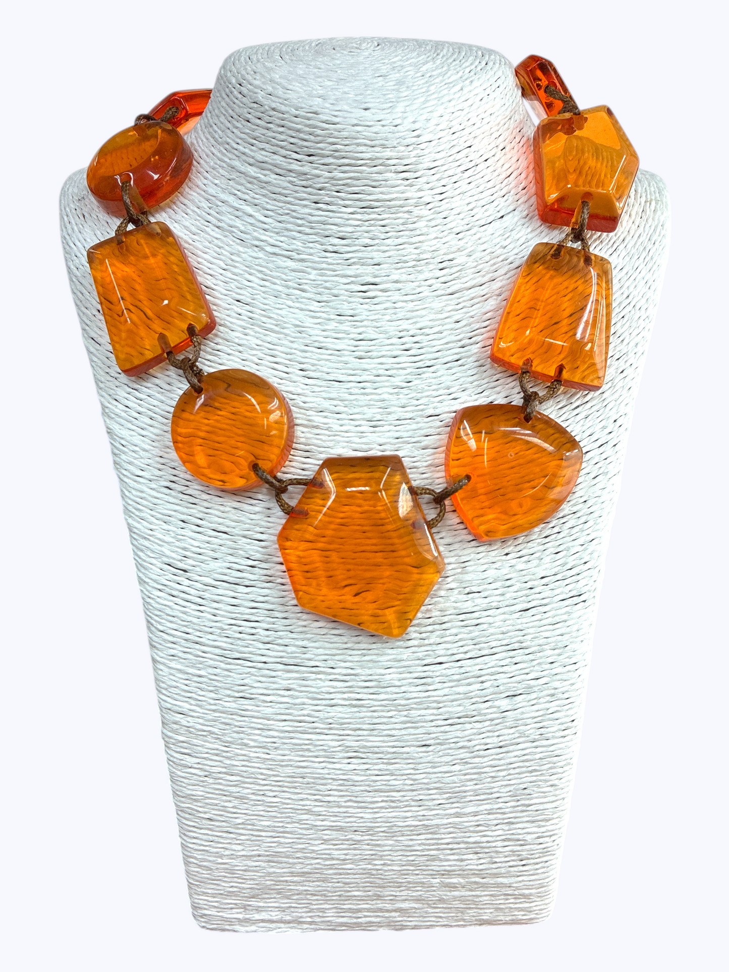 Chunky geometric acrylic necklace featuring oversized translucent faceted beads in a bold modern statement design.