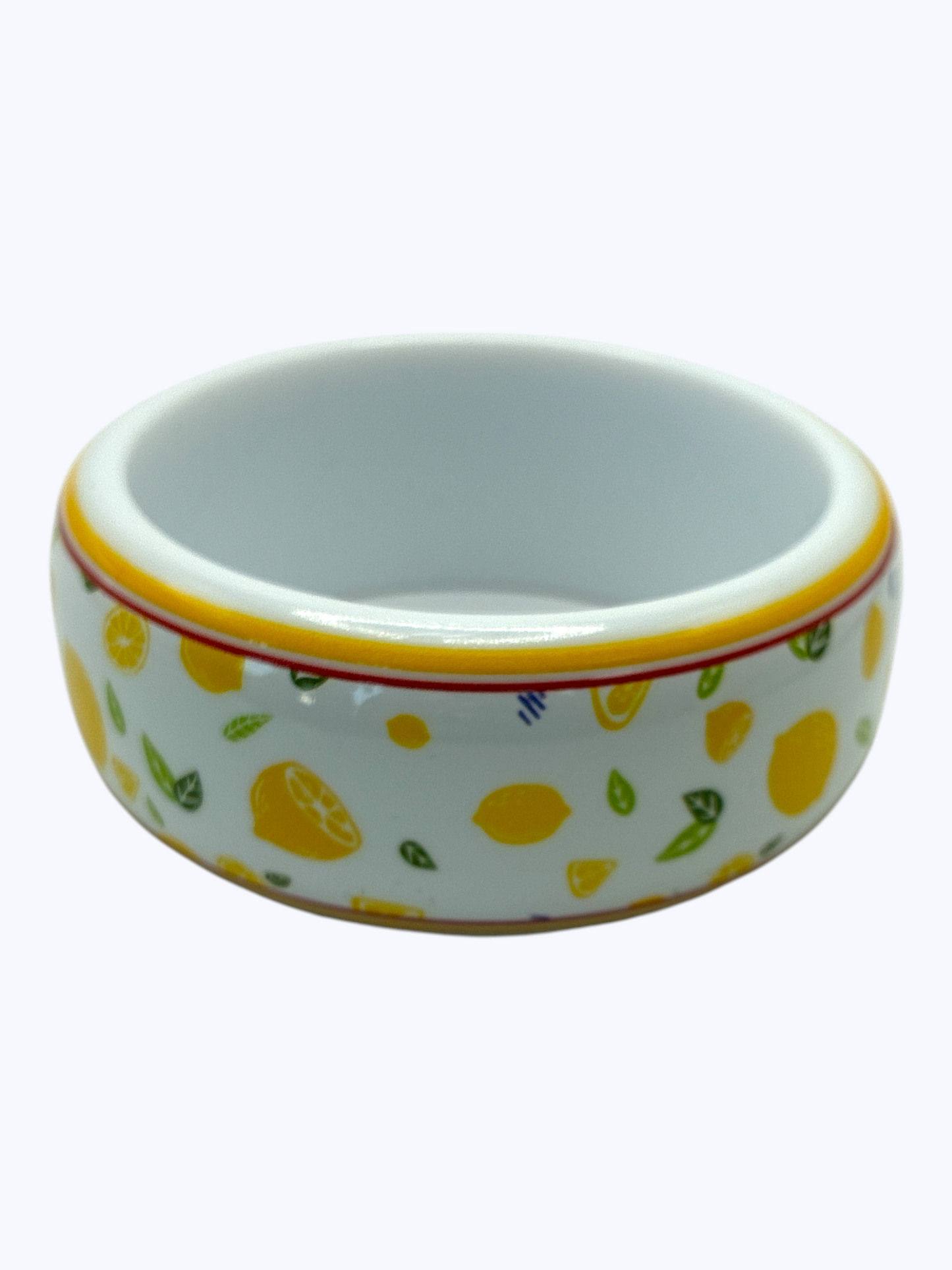Ceramic bowl with lemon pattern on a white background