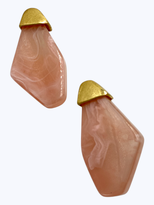 Modern geometric drop earrings featuring abstract marbled resin panels with metallic accent tops.