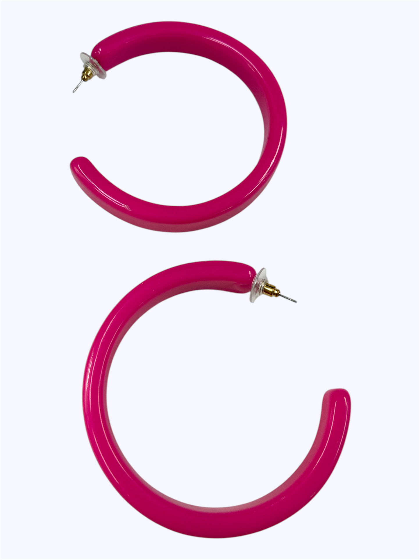 Bold pink open hoop earrings with a chic minimalist hoop design
