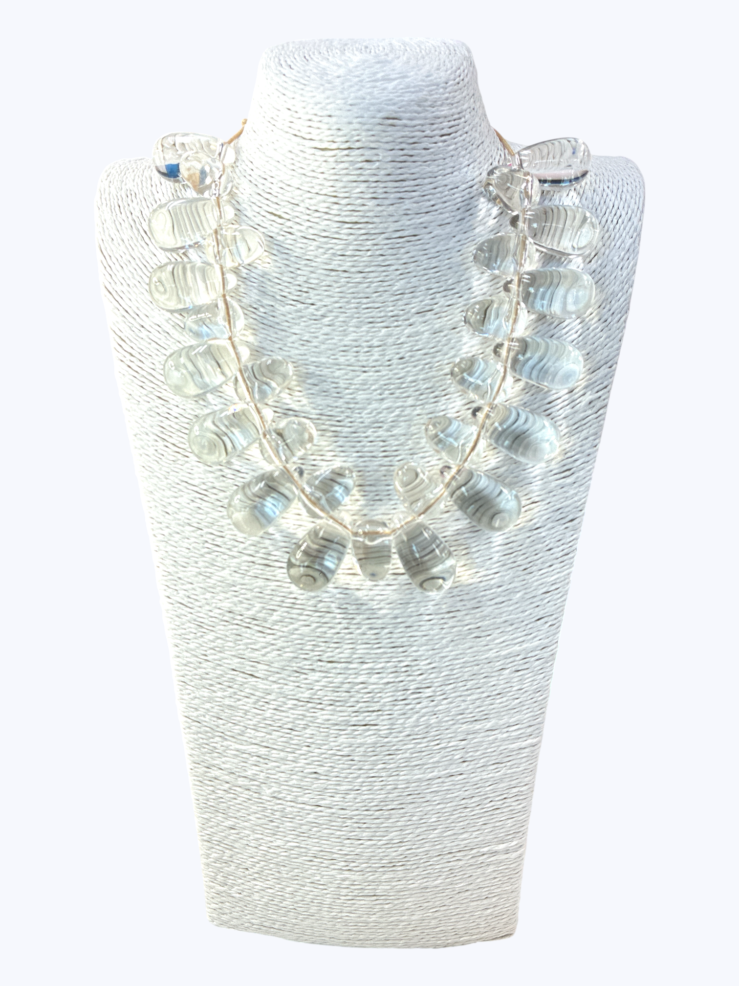 Necklace with clear beads on a white mannequin bust