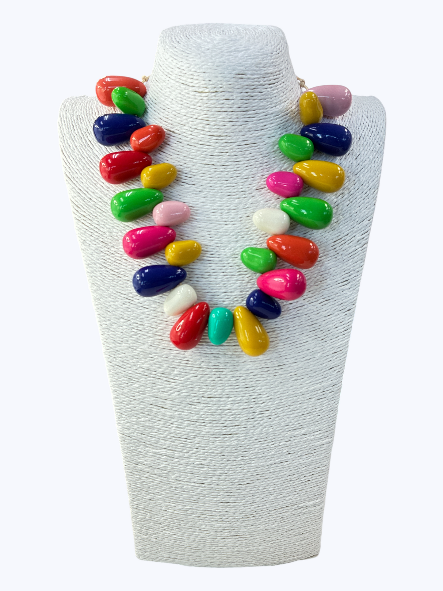 Colorful necklace on a white mannequin bust