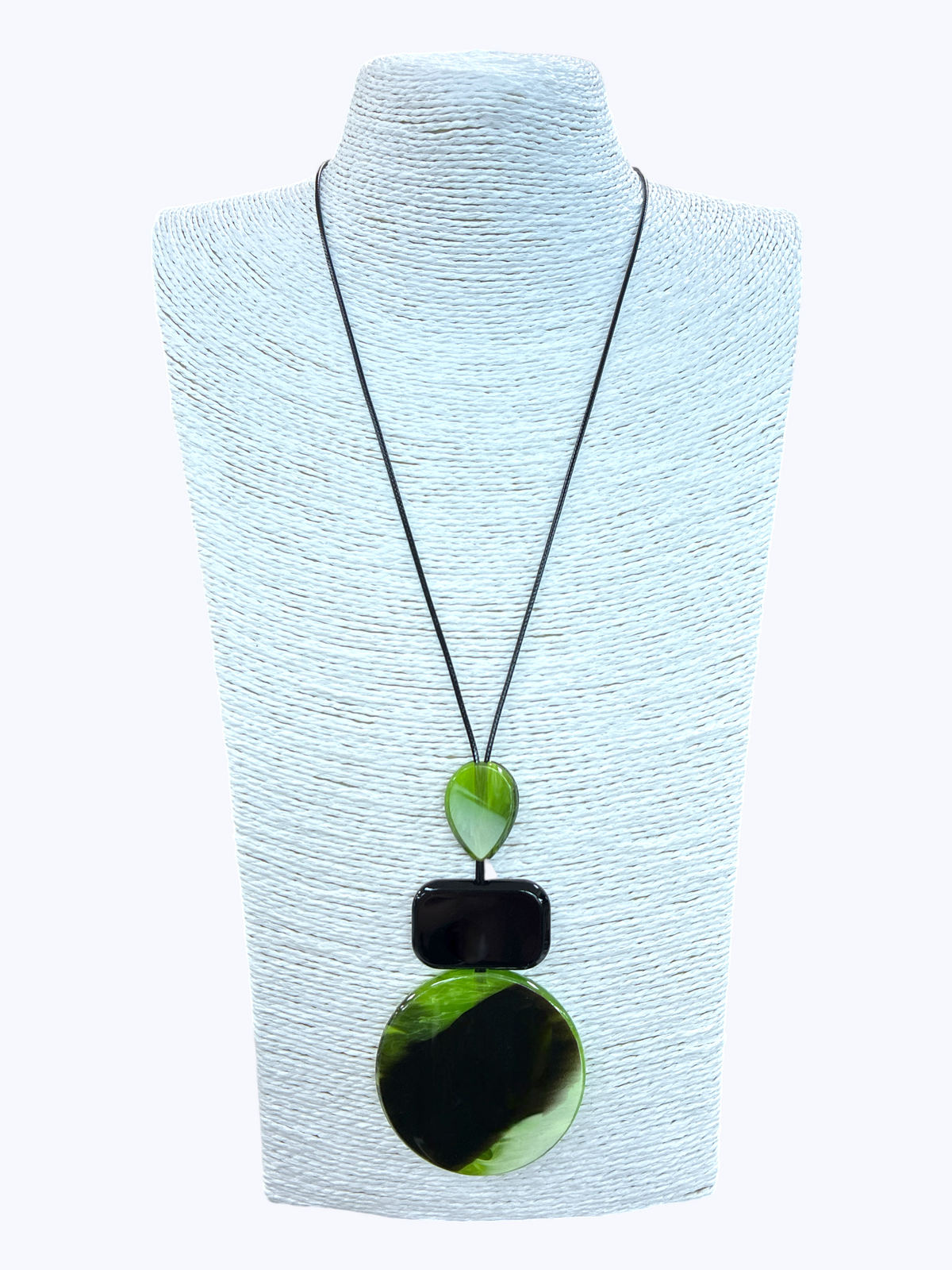 Modern geometric pendant necklace with glossy green and black marbled resin charms on a minimalist black cord for a bold boutique statement look.