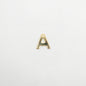 Gold letter 'A' charm on a white background