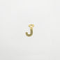 Gold letter 'J' charm on a white background