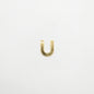 Gold U-shaped pendant on a white background