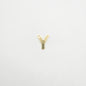 Gold letter 'Y' charm on a light gray background