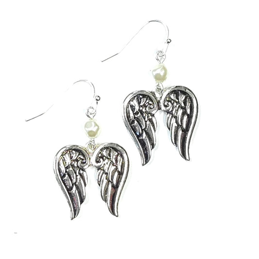 Silver angel wing earrings with pearl accents on a white background