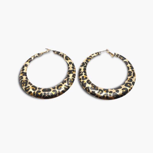 A pair of round hoop earrings with a leopard animal print pattern in gold and black colors.