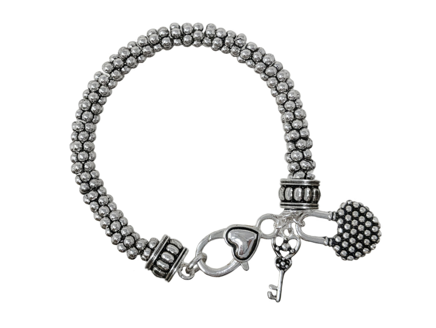 Vintage-inspired multi-strand bead bracelet with key charm details and rustic silver-tone finish.