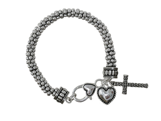 Antique silver-tone beaded bracelet featuring cross and heart charms with textured multi-strand metal bead detailing.