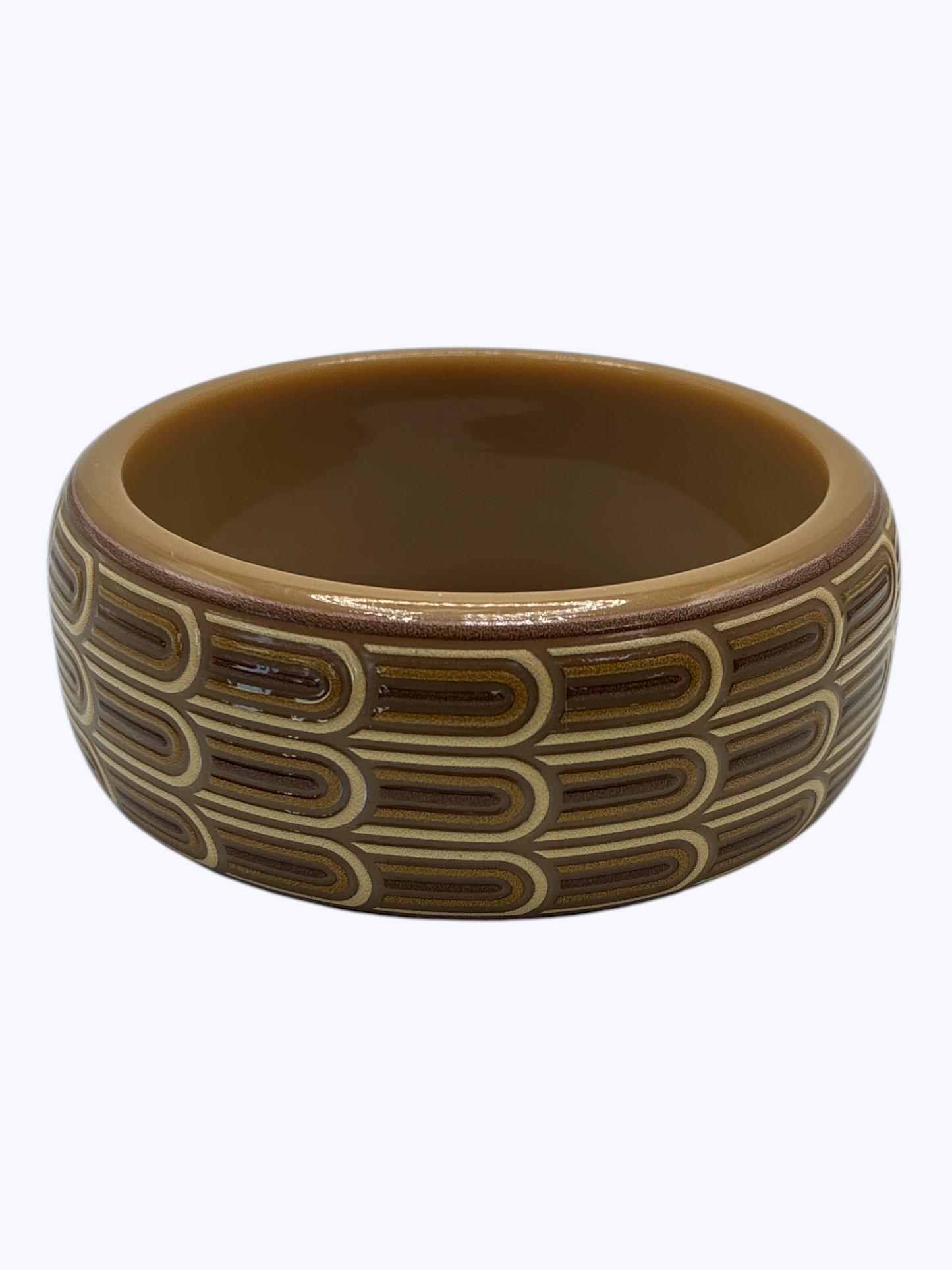 Brown ceramic bowl with decorative patterns on a white background