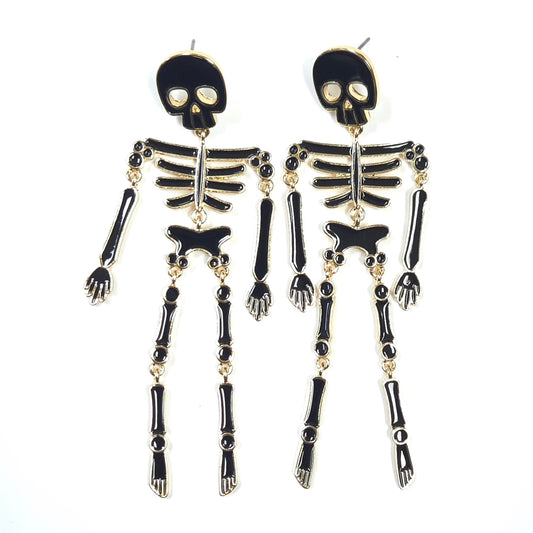 Skeleton design earrings on a white background