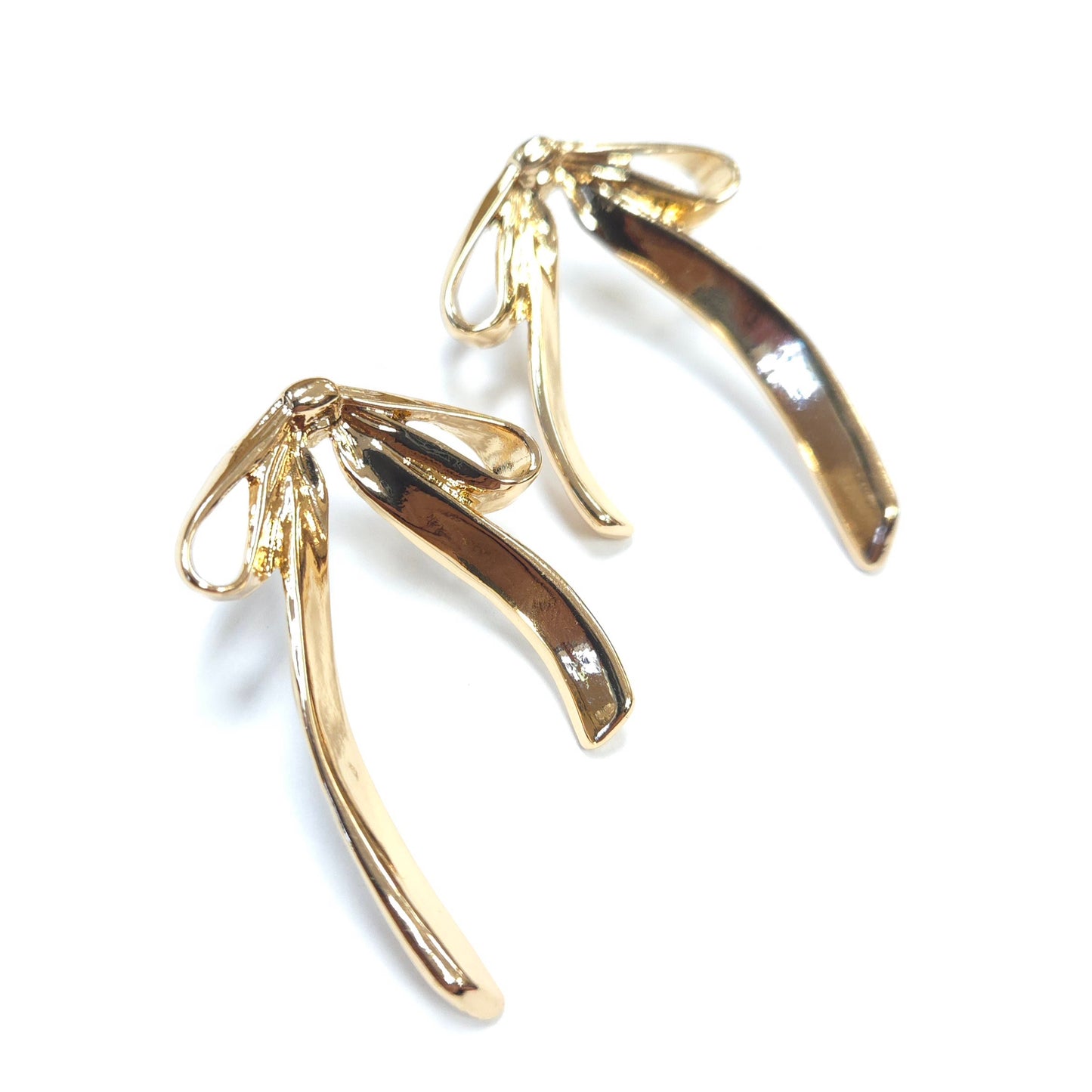 Gold earrings on a white background