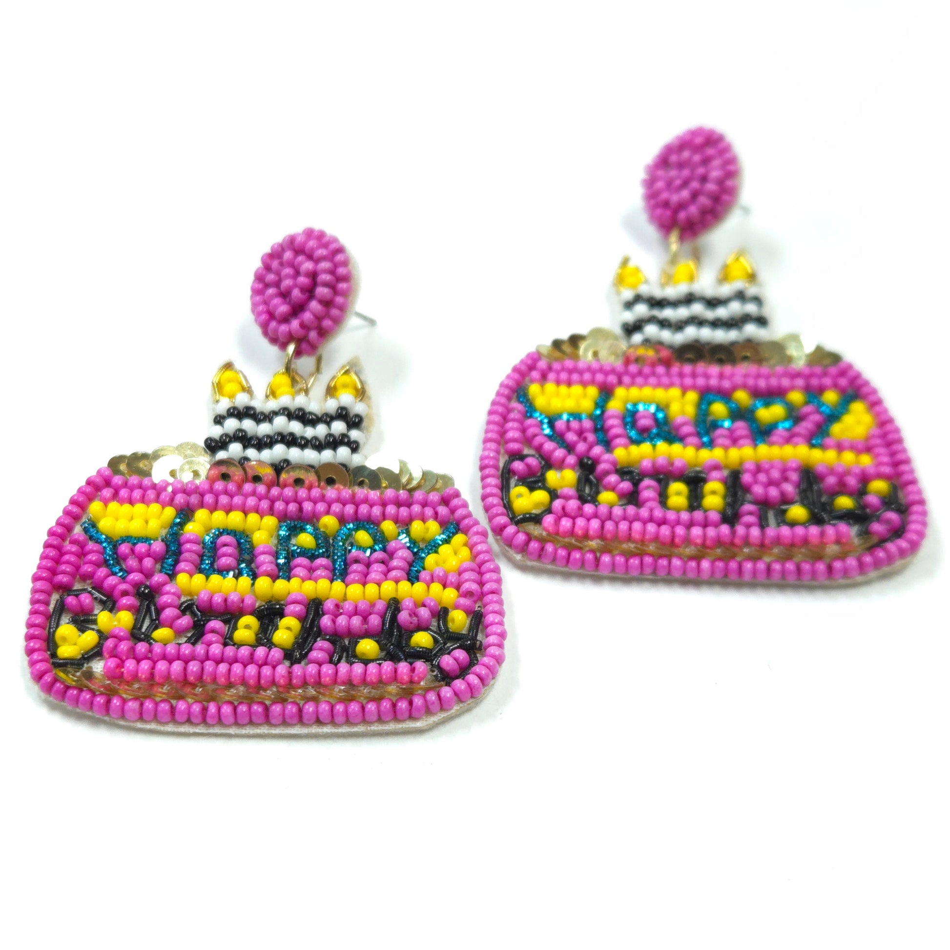 Colorful beaded birthday cake earrings on a white background