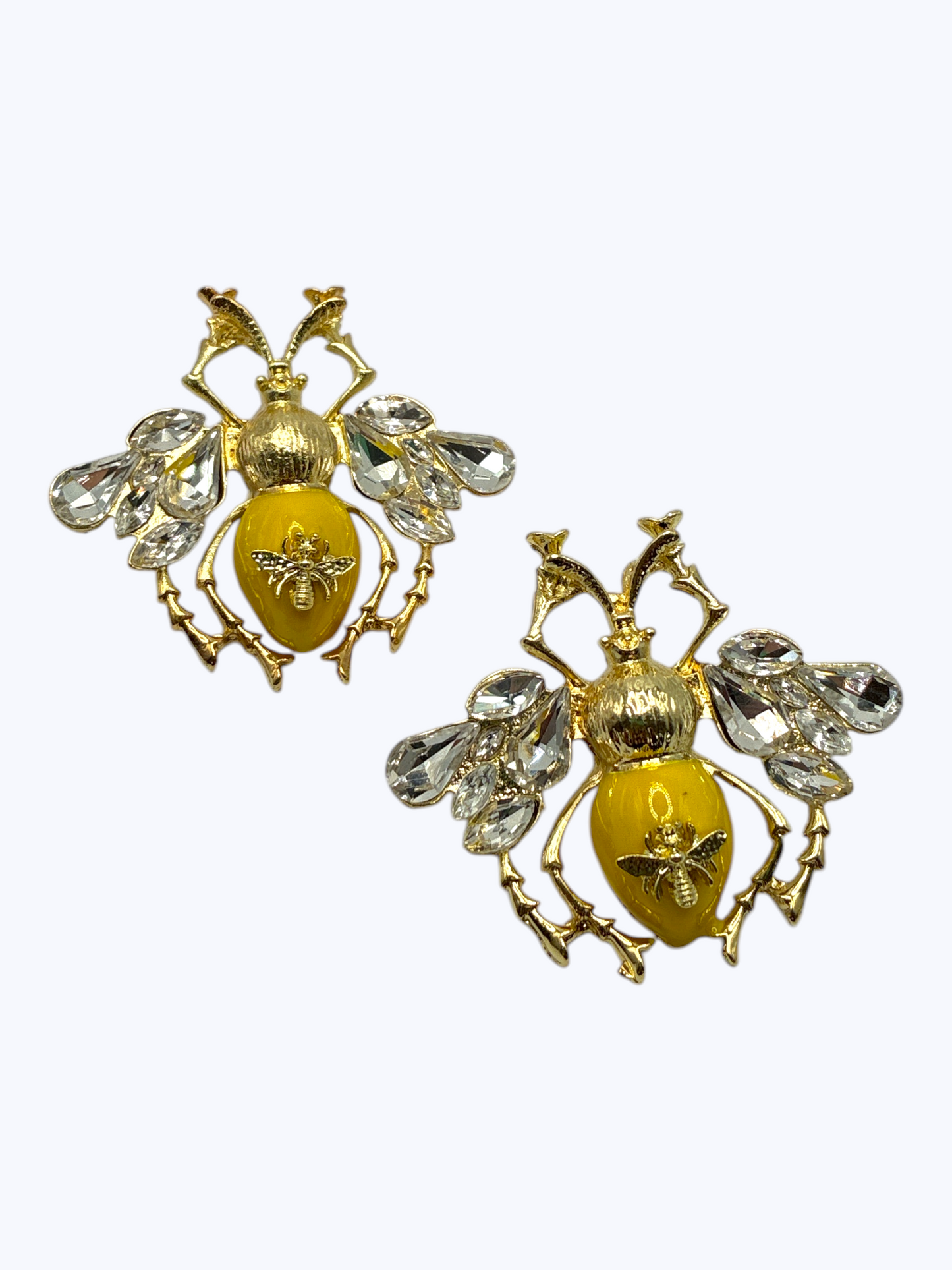 Gold bee statement earrings with crystal wing accents and glossy yellow enamel details for a playful boutique-inspired style.