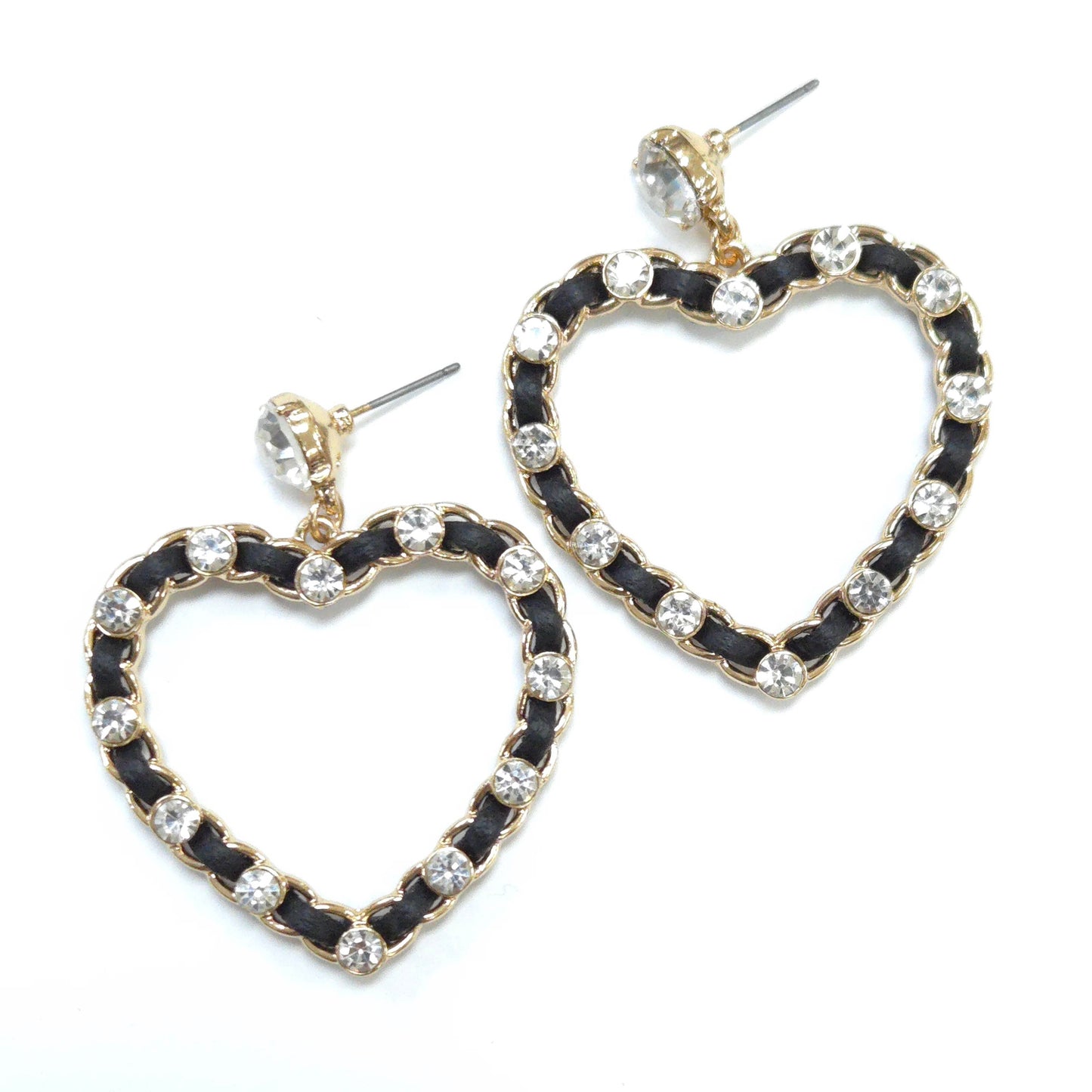 Heart-shaped earrings with black and gold design on a white background