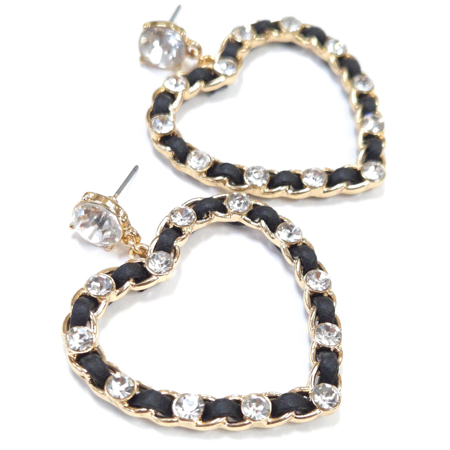Heart-shaped earrings with black and gold design on a white background