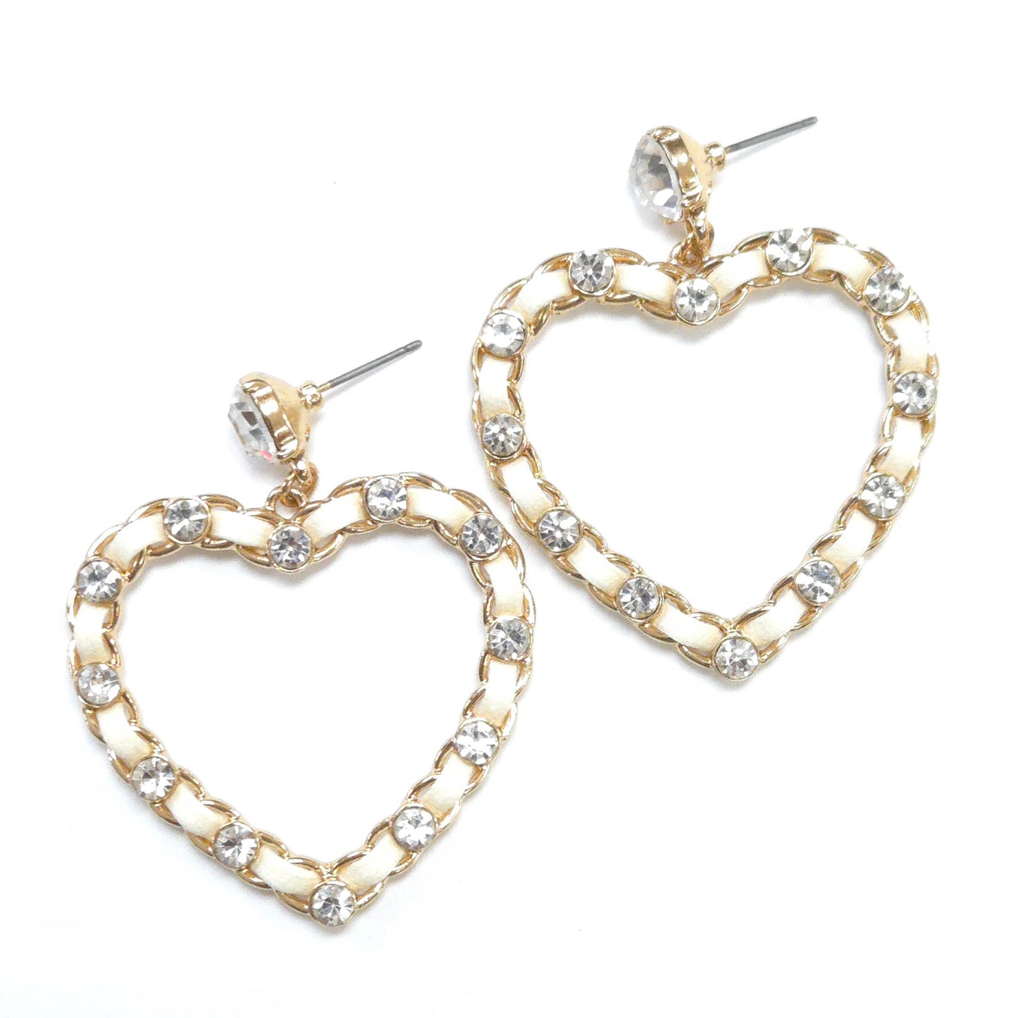 Heart-shaped earrings with gold chain design and clear gemstones on a white background
