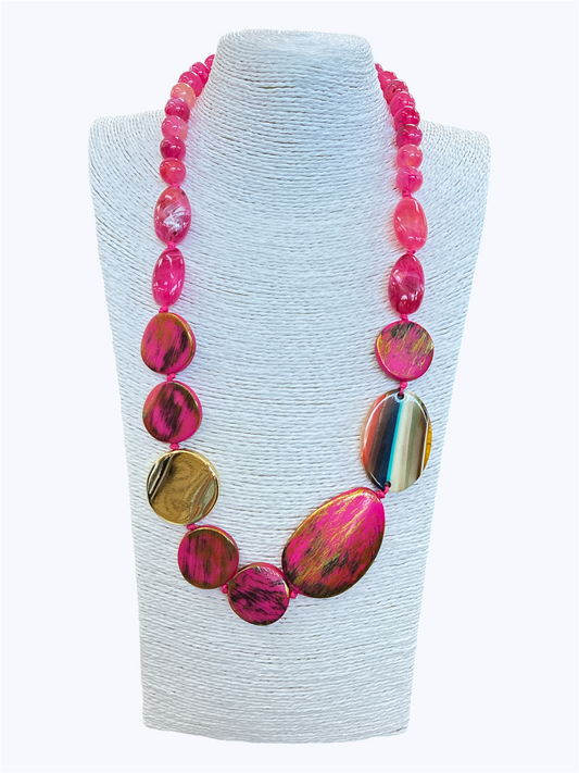 Pink statement bead necklace with glossy marbled and metallic resin accents for a bold artistic boutique-inspired look.