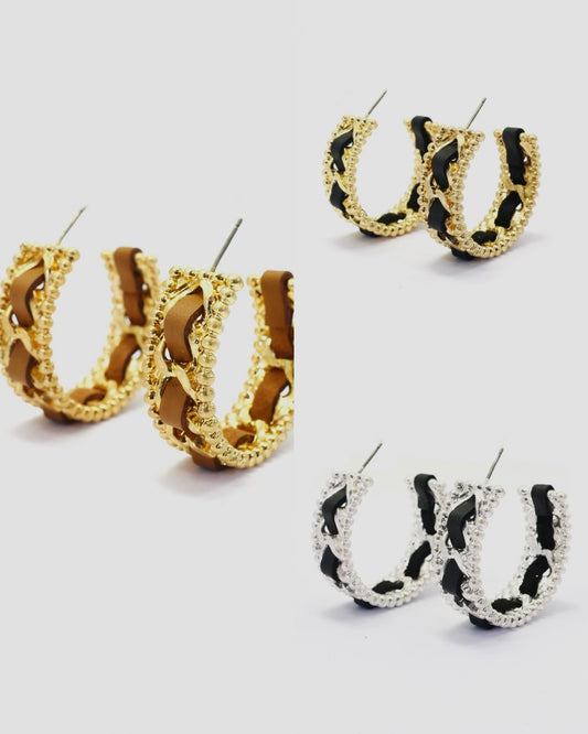 Braided chain hoop earrings with textured beaded edging and woven detail in a modern boutique fashion style.