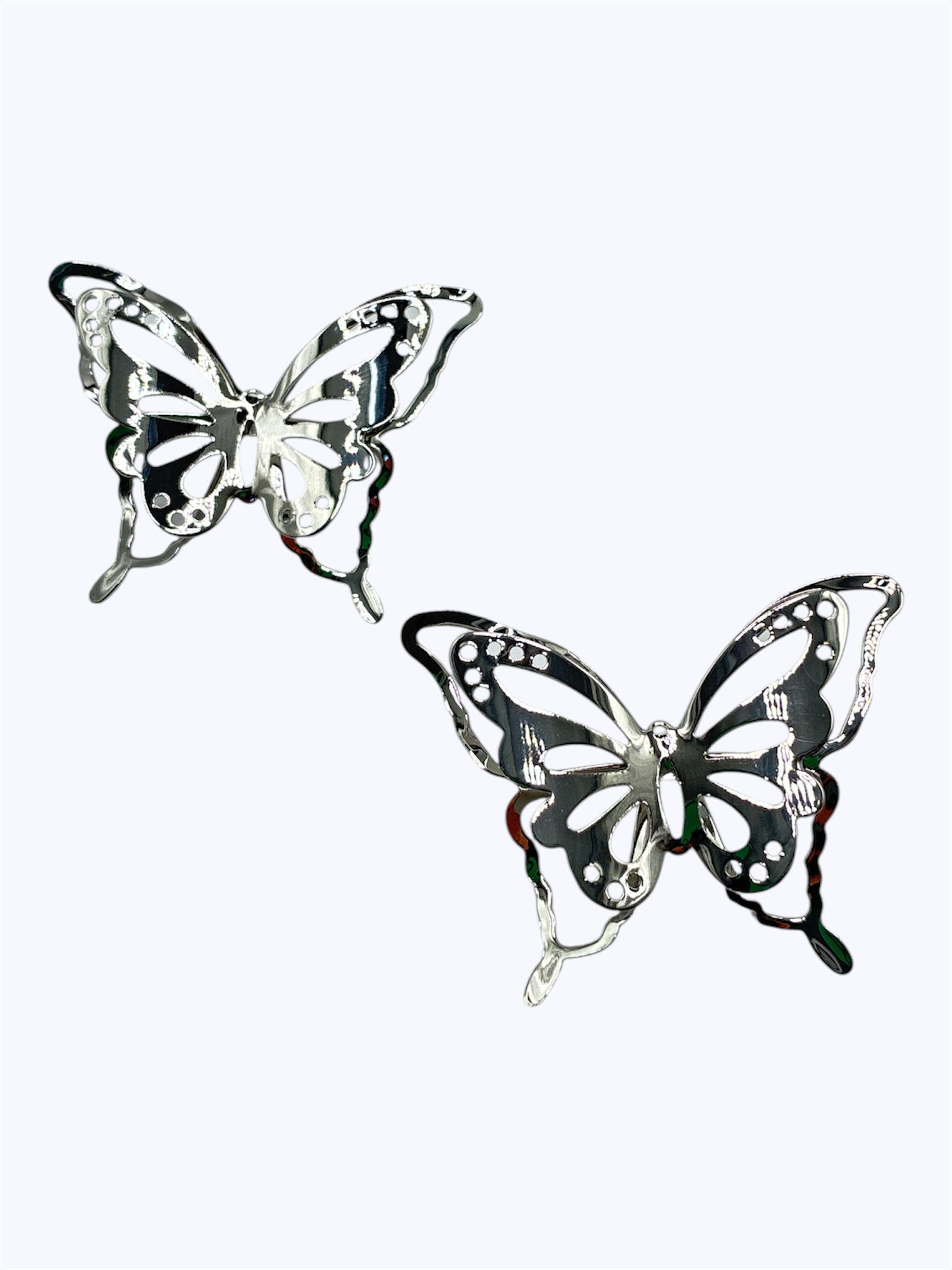 Silver butterfly outline earrings with a lightweight openwork silhouette and modern feminine look