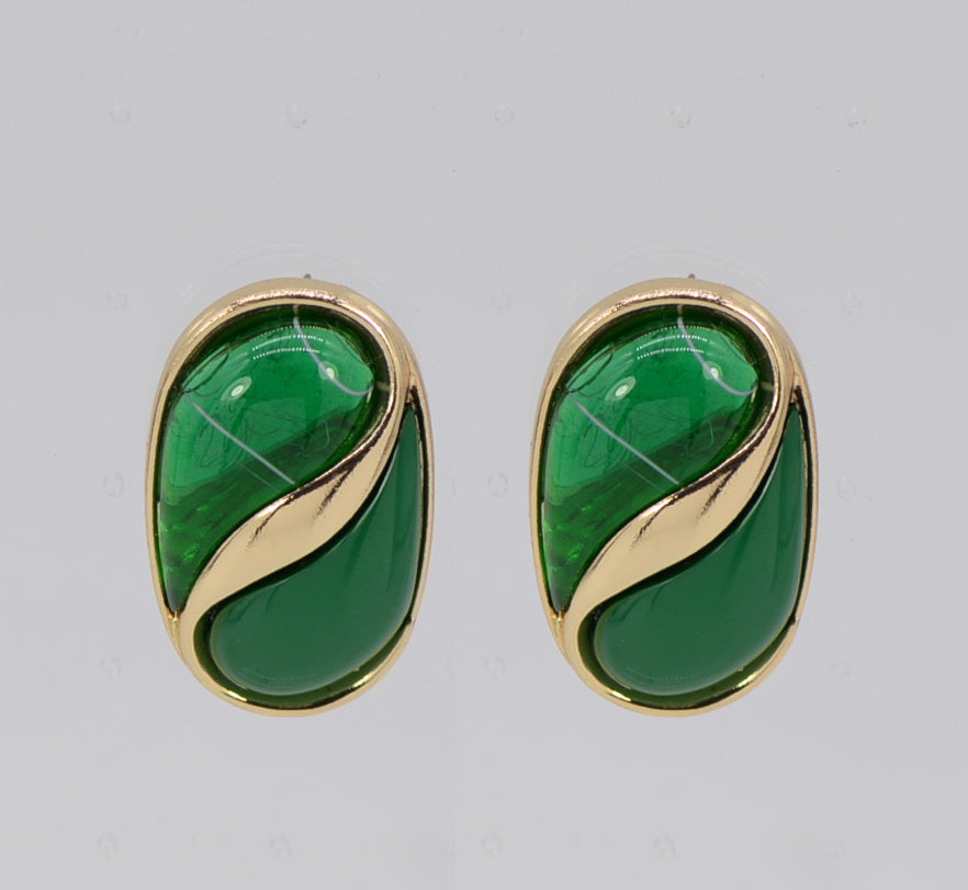 Pair of green stone earrings with gold accents on a light gray background