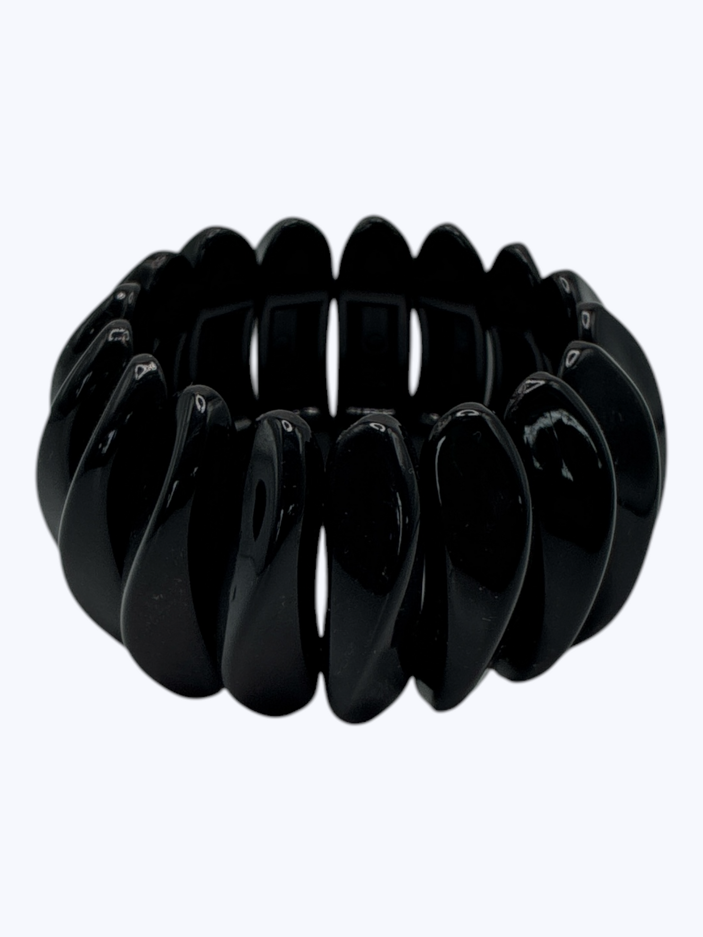 Chunky black stretch bracelet with glossy oversized resin links for a sleek modern boutique-inspired style.