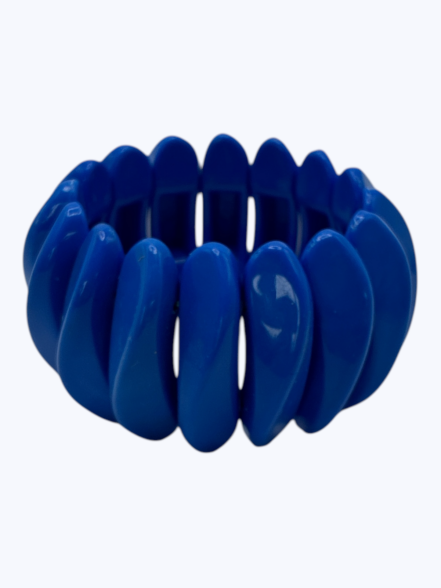 Chunky cobalt blue stretch bracelet with glossy oversized resin links for a vibrant contemporary boutique look.