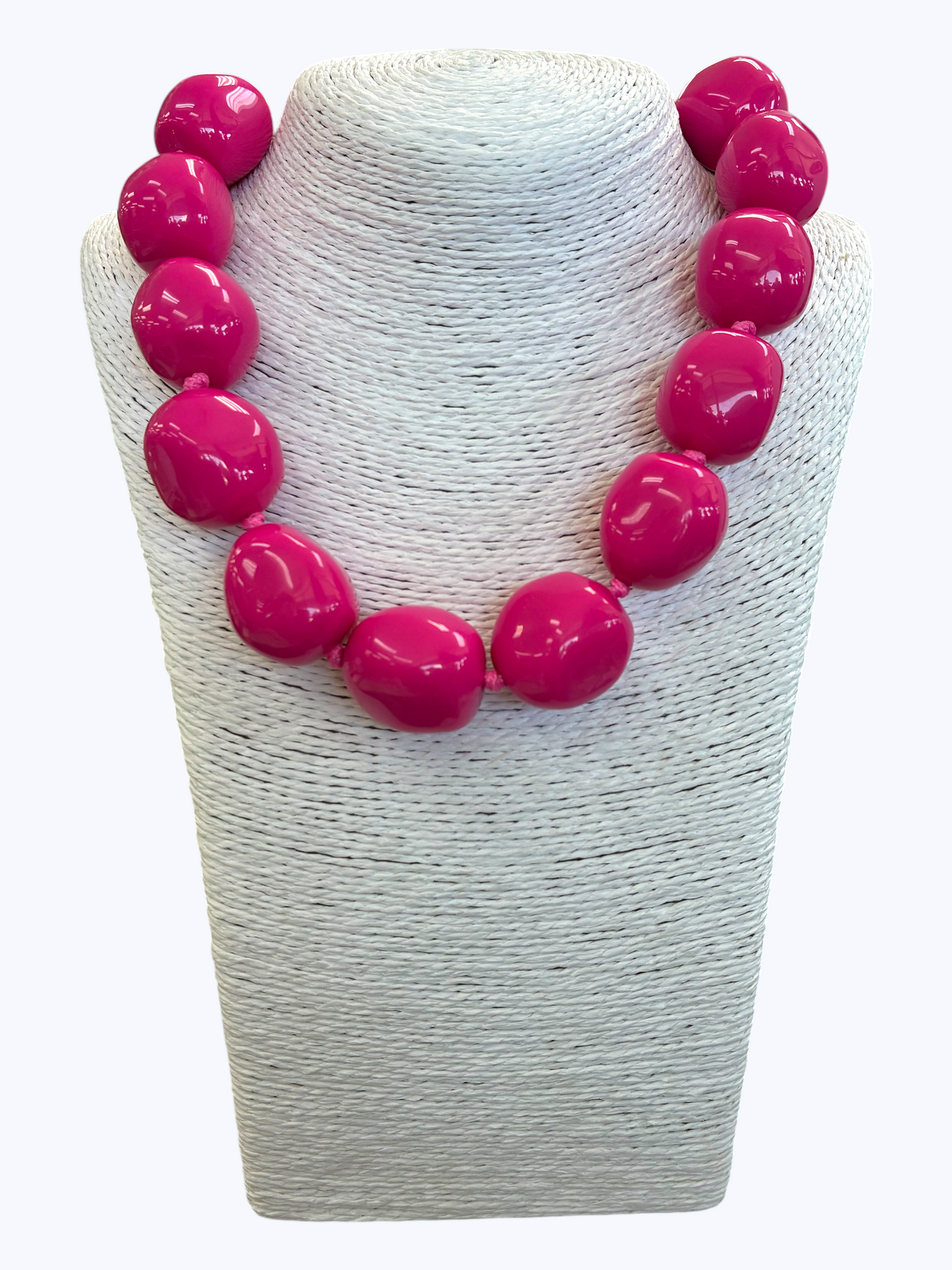 Chunky hot pink statement necklace with oversized glossy resin beads for a playful boutique-inspired style.