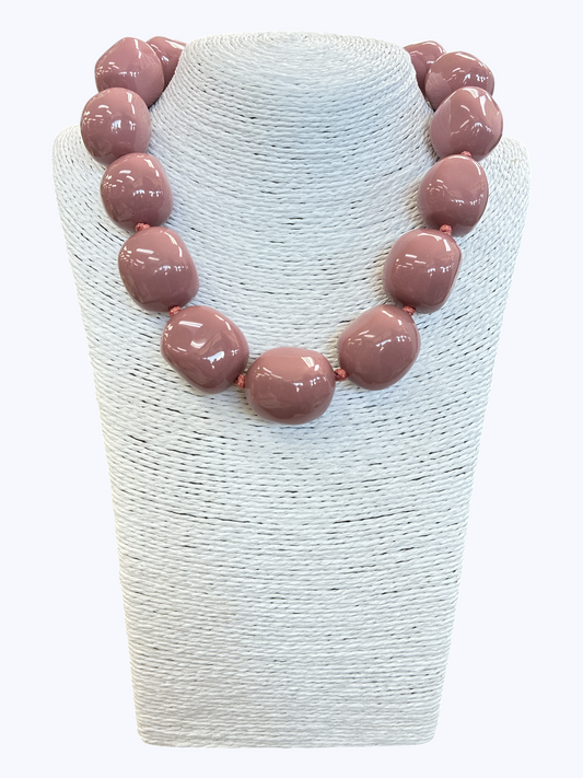 Chunky mauve statement necklace with oversized glossy resin beads for an elegant contemporary boutique look.