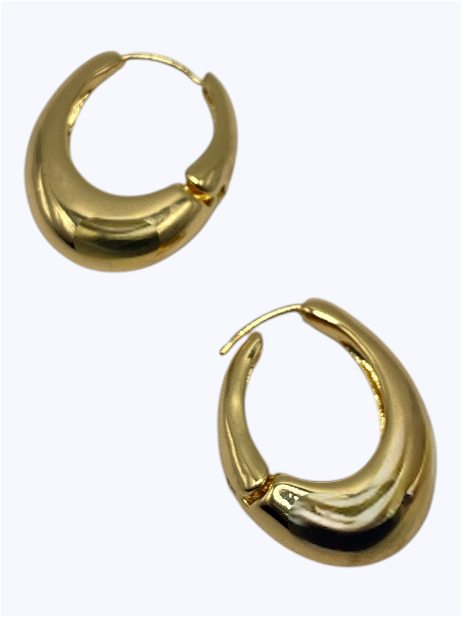 Gold hoop earrings on a white background