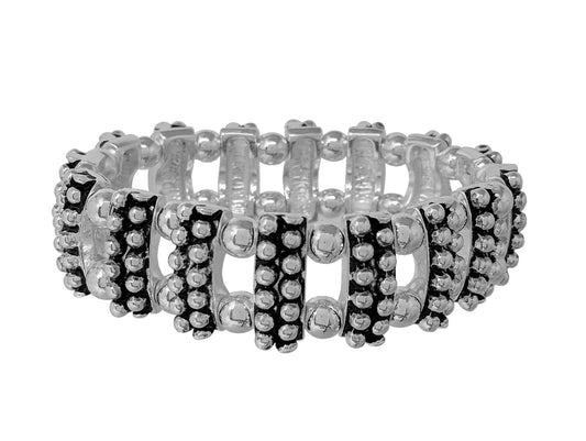 Wide stretch bracelet with textured silver-tone links, beaded detailing, and bold antique-inspired design.