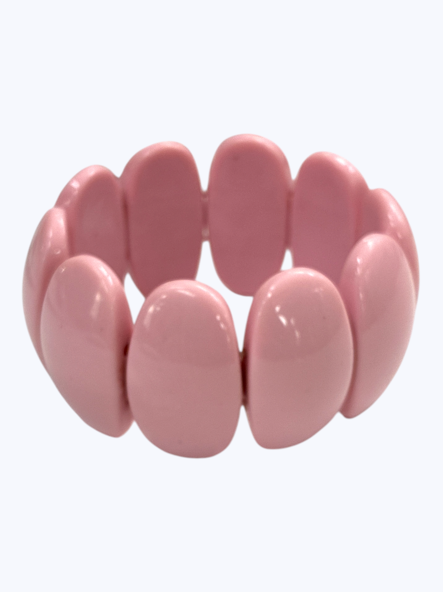Chunky blush pink stretch bracelet with glossy oversized resin links for a soft chic boutique-inspired style.