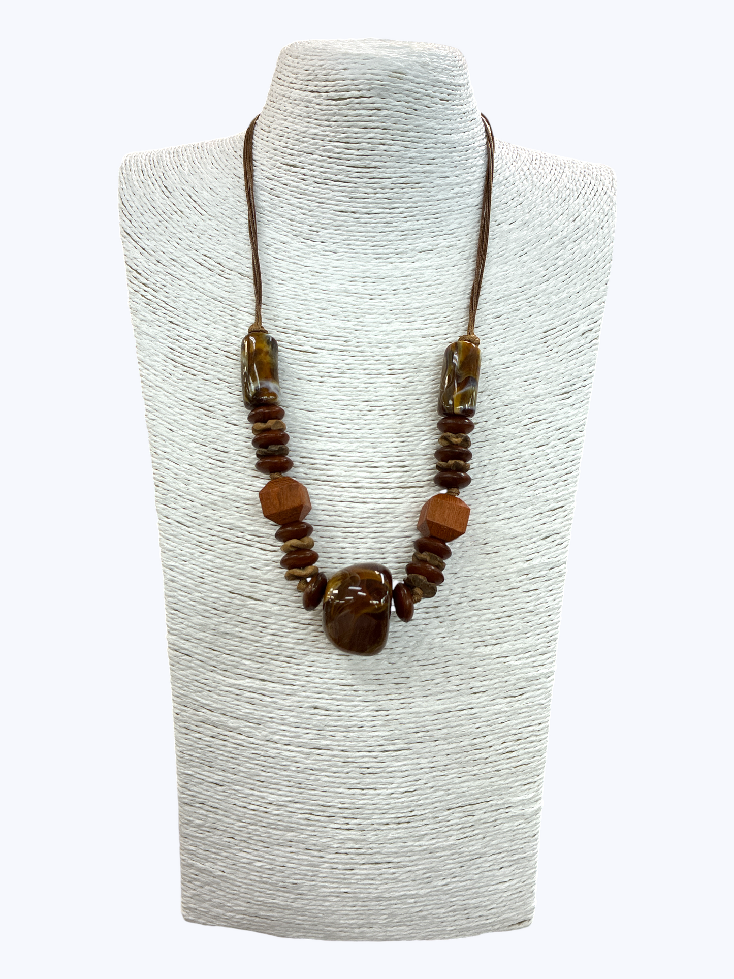 Brown marbled statement necklace with wooden accent beads, earthy stone details, and braided cord for a rustic boutique-inspired style.