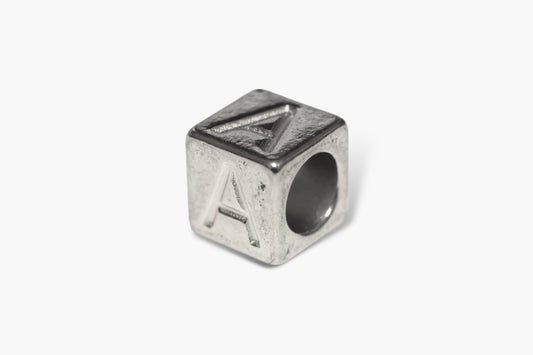 Silver cube charm with letter 'A' on a white background