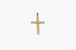 Gold cross pendant on a white background