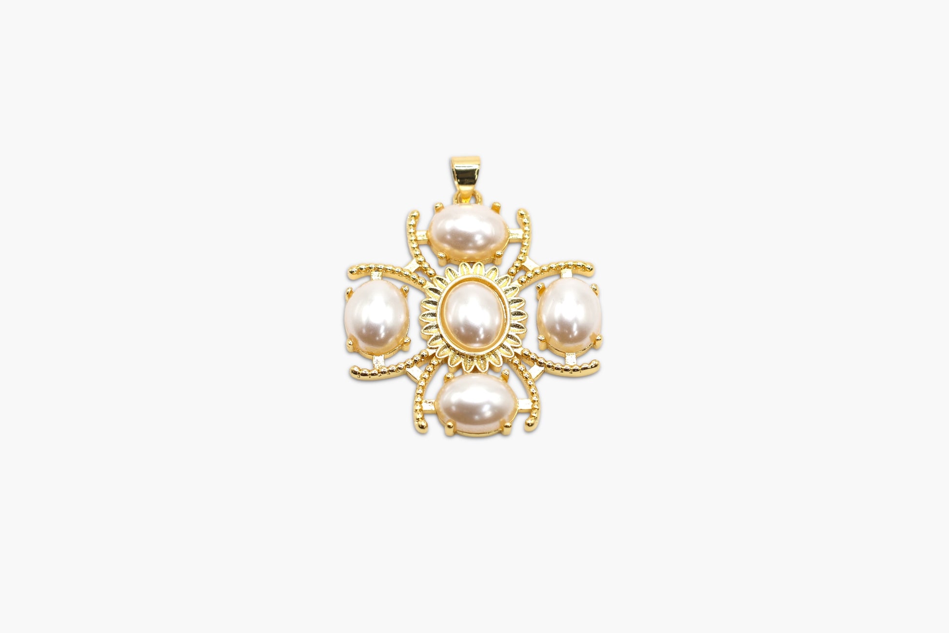Gold pendant with pearls on a white background
