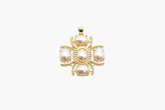 Gold pendant with pearls on a white background