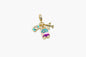 Gold charm with airplane, car, and heart design on a white background