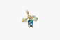 Multicolored charm with a blue car, suitcase, and heart on a white background