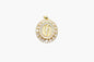 Gold and diamond pendant on a white background